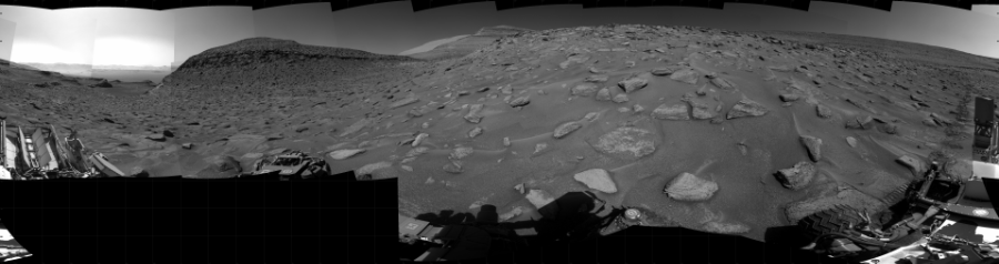 NASA's Mars rover Curiosity took 31 images in Gale Crater using its mast-mounted Right Navigation Camera (Navcam) to create this mosaic. The seam-corrected mosaic provides a 360-degree cylindrical projection panorama of the Martian surface centered at 115 degrees azimuth (measured clockwise from north). Curiosity took the images on June 20, 2023, Sol 3864 of the Mars Science Laboratory mission at drive 2294, site number 101. The local mean solar time for the image exposures was from 1 PM to 2 PM. Each Navcam image has a 45 degree field of view. CREDIT: NASA/JPL-Caltech