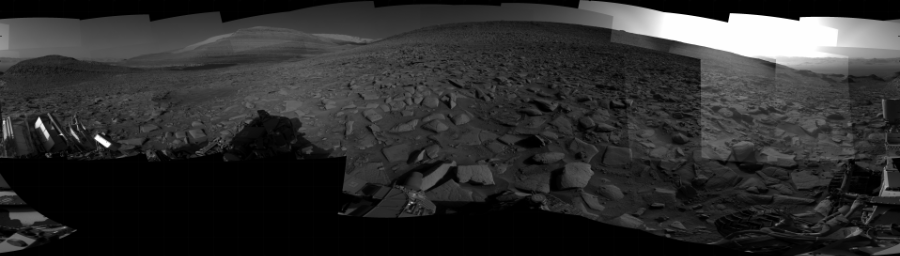 NASA's Mars rover Curiosity took 31 images in Gale Crater using its mast-mounted Right Navigation Camera (Navcam) to create this mosaic. The seam-corrected mosaic provides a 360-degree cylindrical projection panorama of the Martian surface centered at 185 degrees azimuth (measured clockwise from north). Curiosity took the images on July 26, 2023, Sol 3899 of the Mars Science Laboratory mission at drive 2428, site number 102. The local mean solar time for the image exposures was from 3 PM to 4 PM. Each Navcam image has a 45 degree field of view. CREDIT: NASA/JPL-Caltech