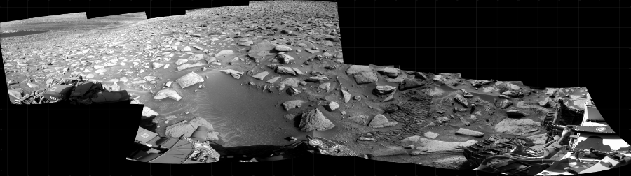 NASA's Mars rover Curiosity took 12 images in Gale Crater using its mast-mounted Right Navigation Camera (Navcam) to create this mosaic. The seam-corrected mosaic provides a 309-degree cylindrical projection panorama of the Martian surface centered at 221 degrees azimuth (measured clockwise from north). Curiosity took the images on August 03, 2023, Sol 3906 of the Mars Science Laboratory mission at drive 112, site number 103. The local mean solar time for the image exposures was 3 PM. Each Navcam image has a 45 degree field of view. CREDIT: NASA/JPL-Caltech