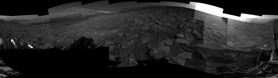 NASA's Mars rover Curiosity took 25 images in Gale Crater using its mast-mounted Right Navigation Camera (Navcam) to create this mosaic. The seam-corrected mosaic provides a 360-degree cylindrical projection panorama of the Martian surface centered at 185 degrees azimuth (measured clockwise from north). Curiosity took the images on August 09, 2023, Sol 3912 of the Mars Science Laboratory mission at drive 694, site number 103. The local mean solar time for the image exposures was from 3 PM to 4 PM. Each Navcam image has a 45 degree field of view. CREDIT: NASA/JPL-Caltech