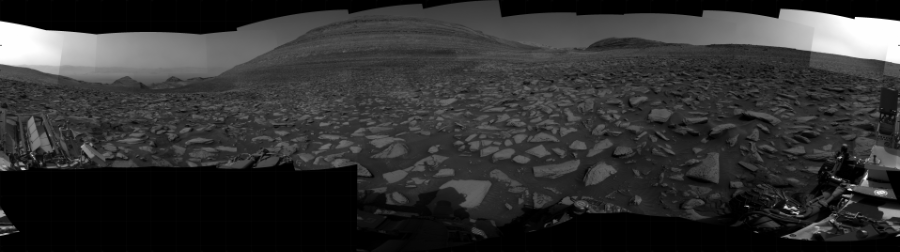 NASA's Mars rover Curiosity took 31 images in Gale Crater using its mast-mounted Right Navigation Camera (Navcam) to create this mosaic. The seam-corrected mosaic provides a 360-degree cylindrical projection panorama of the Martian surface centered at 110 degrees azimuth (measured clockwise from north). Curiosity took the images on December 15, 2023, Sol 4037 of the Mars Science Laboratory mission at drive 936, site number 105. The local mean solar time for the image exposures was 2 PM. Each Navcam image has a 45 degree field of view. CREDIT: NASA/JPL-Caltech