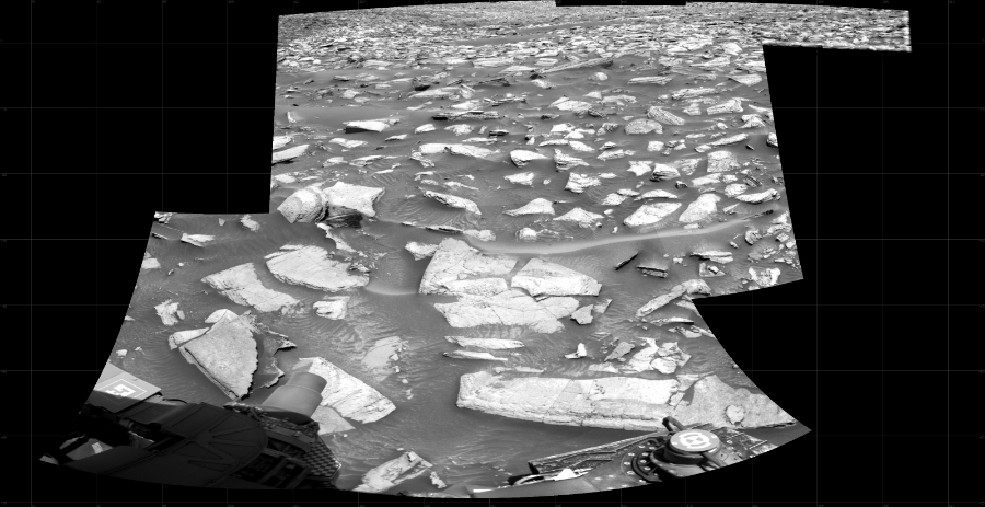 NASA's Mars rover Curiosity took 5 images in Gale Crater using its mast-mounted Right Navigation Camera (Navcam) to create this mosaic. The seam-corrected mosaic provides a 150-degree cylindrical projection panorama of the Martian surface centered at 140 degrees azimuth (measured clockwise from north). Curiosity took the images on January 05, 2024, Sol 4057 of the Mars Science Laboratory mission at drive 1198, site number 105. The local mean solar time for the image exposures was 12 PM. Each Navcam image has a 45 degree field of view. CREDIT: NASA/JPL-Caltech