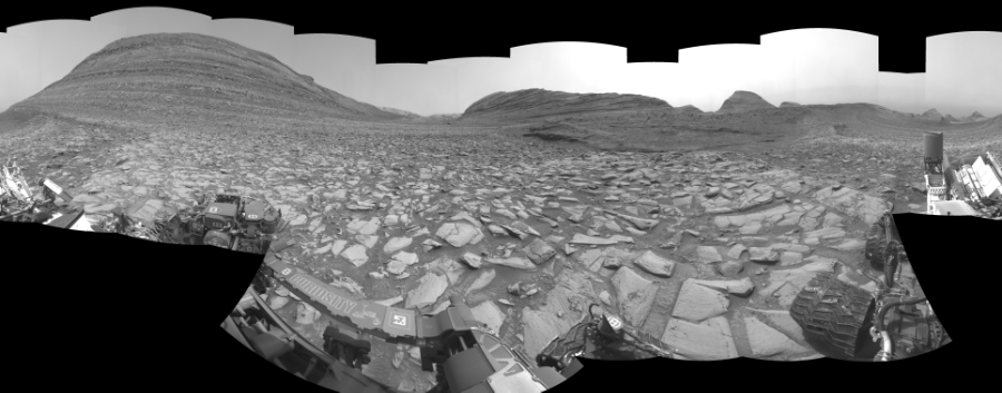 NASA's Mars rover Curiosity took 30 images in Gale Crater using its mast-mounted Left Navigation Camera (Navcam) to create this mosaic. The seam-corrected mosaic provides a 360-degree cylindrical-perspective projection panorama of the Martian surface suitable for stereo viewing, centered at 33 degrees azimuth (measured clockwise from north). This single-eye view must be combined with the partner right image to be viewed in stereo.  Curiosity took the images on March 18, 2024, Sol 4128 of the Mars Science Laboratory mission at drive 708, site number 106. The local mean solar time for the image exposures was 1 PM. Each Navcam image has a 45-degree field of view. CREDIT: NASA/JPL-Caltech