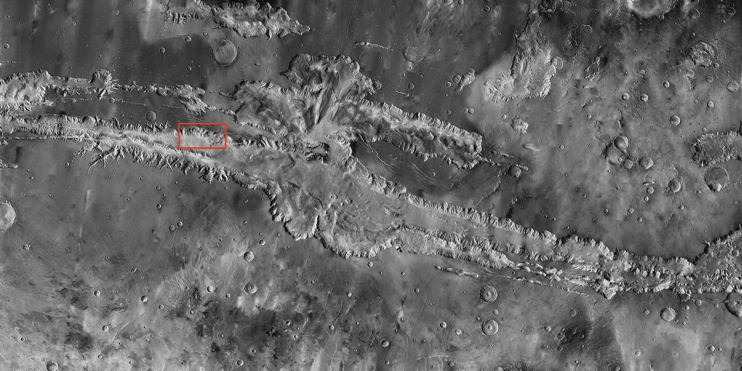 Valles Marineris, the "Grand Canyon of Mars," sprawls wide enough to reach from Los Angeles to nearly New York City, if it were located on Earth. The red outline box shows the location of a second, full-resolution image.