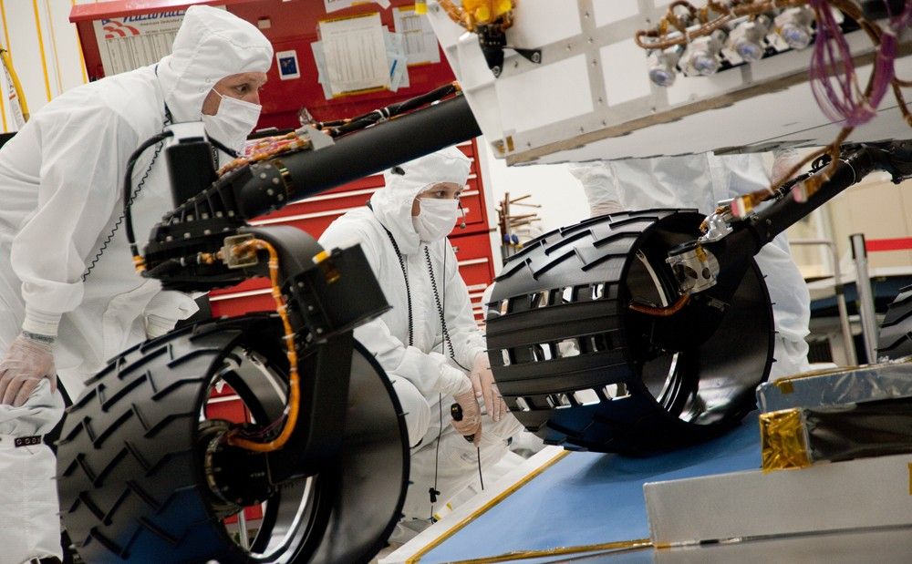 Test operators monitor how NASA's Mars rover Curiosity handles driving over a ramp during a test on Sept. 10, 2010, inside the Spacecraft Assembly Facility at NASA's Jet Propulsion Laboratory, Pasadena, Calif.
