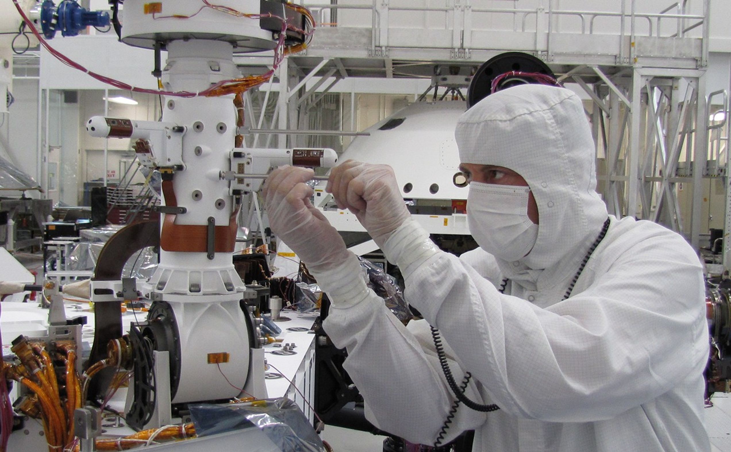 Sensors on two finger-like mini-booms extending horizontally from the mast of NASA's Mars rover Curiosity will monitor wind speed, wind direction and air temperature.