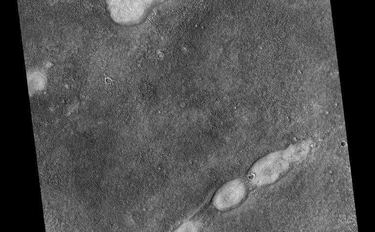 This proposed future Mars landing site in Acidalia Planitia targets densely occurring mounds thought to be mud volcanoes.
