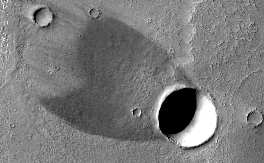 Wind shadow and real shadow combine to give a striking image of a comet.