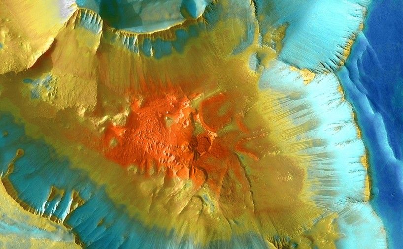 A false-color mosaic focuses on one junction in Noctis Labyrinthus where canyons meet to form a depression 4,000 meters (13,000 feet) deep.