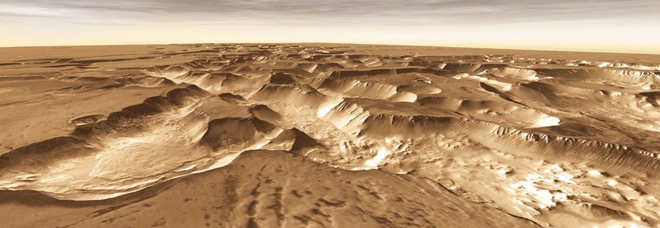 West of Valles Marineris lies a checkerboard named Noctis Labyrinthus, which formed when the Martian crust stretched and fractured.