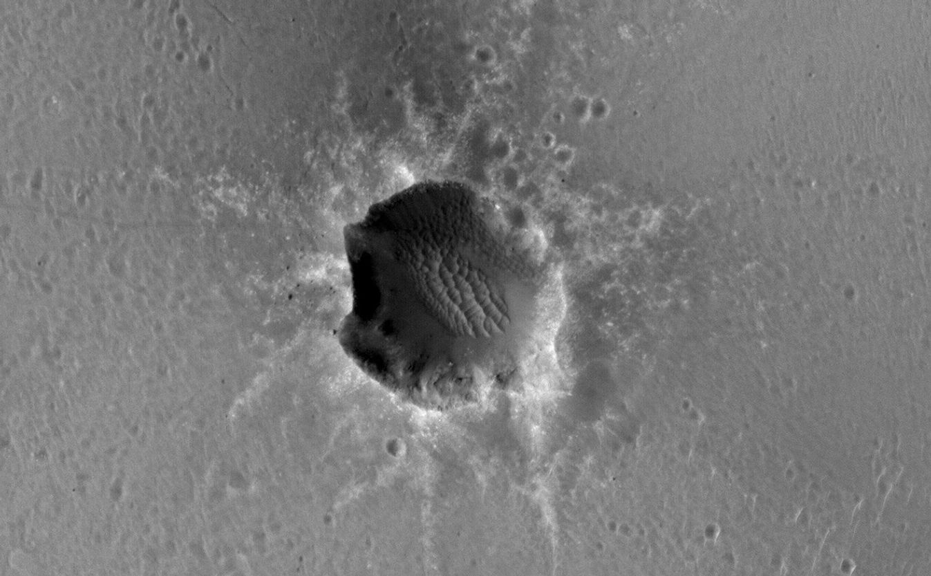 The High Resolution Imaging Science Experiment (HiRISE) camera on NASA's Mars Reconnaissance Orbiter acquired this image of the Opportunity rover on the southwest rim of "Santa Maria" crater on New Year's Eve 2010, or Martian day (sol) 2466 of the rover's work on Mars.