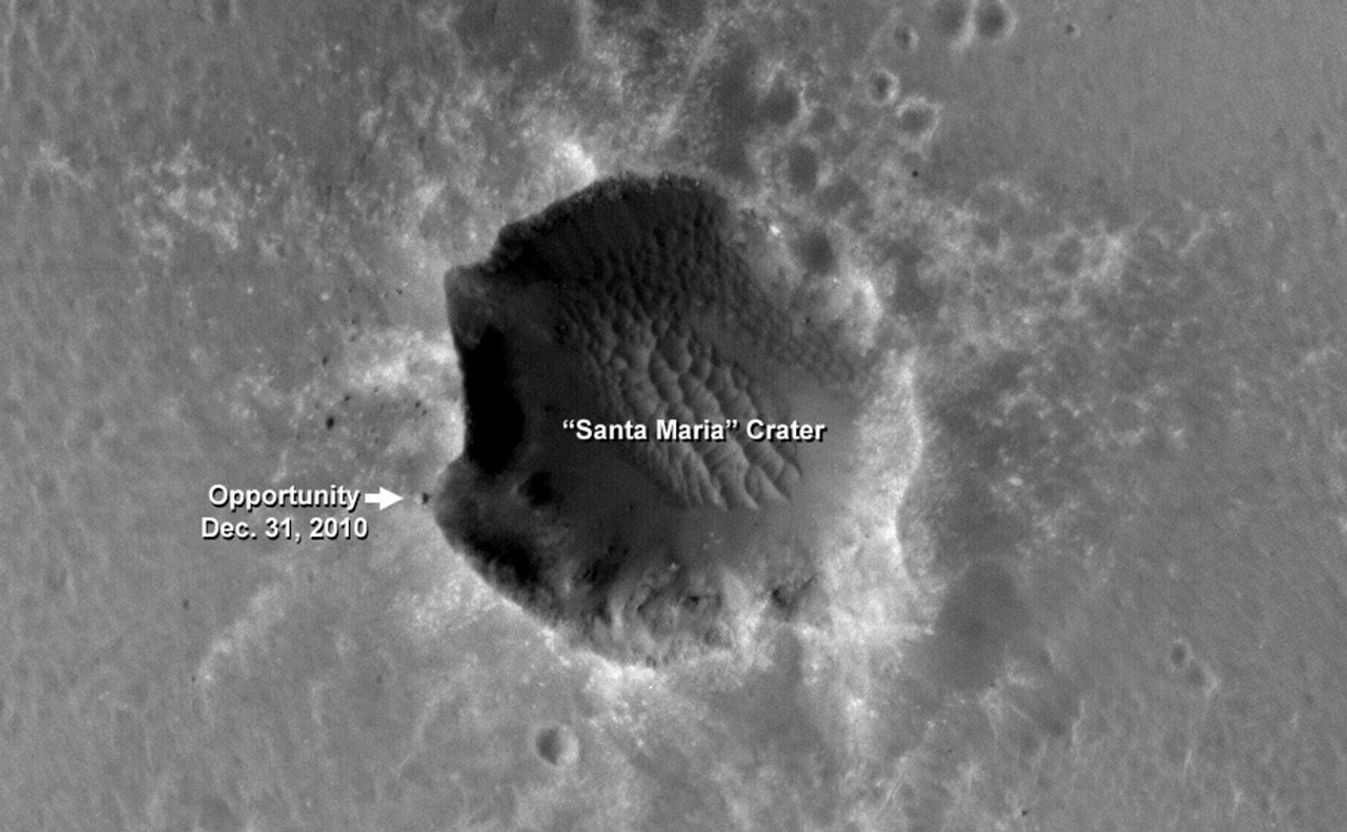The High Resolution Imaging Science Experiment (HiRISE) camera on NASA's Mars Reconnaissance Orbiter acquired this image of the Opportunity rover on the southwest rim of "Santa Maria" crater on New Year's Eve 2010, or Martian day (sol) 2466 of the rover's work on Mars.