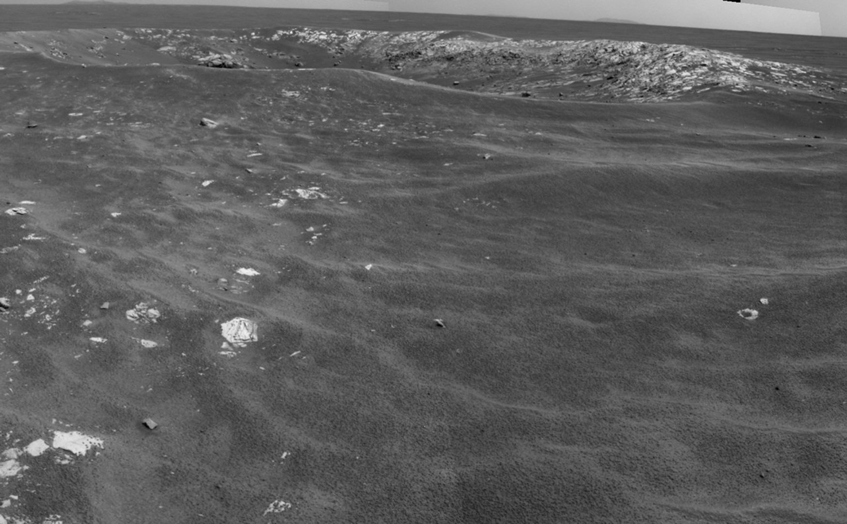 NASA's Mars Exploration Rover Opportunity recorded this view of a crater informally named "Freedom 7" shortly before the 50th anniversary of the first American in space: astronaut Alan Shepard's flight in the Freedom 7 spacecraft.