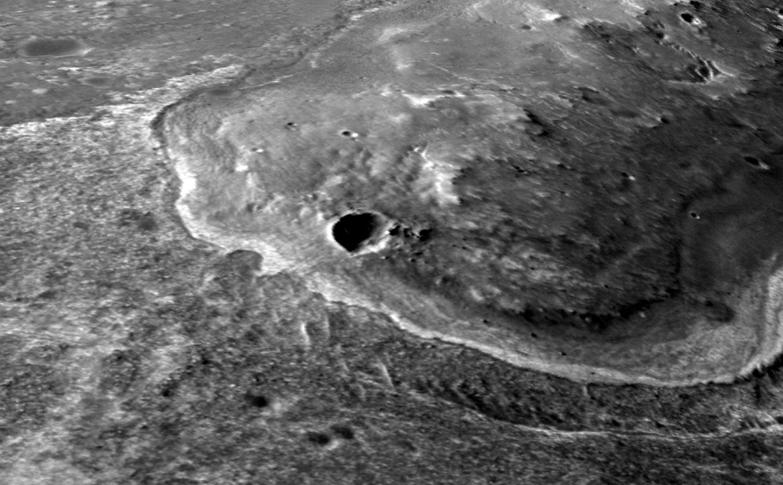 This oblique view with moderate vertical exaggeration shows the portion of the rim of Endeavour crater given the informal name "Spirit Point."  This is the location where the team operating NASA's Mars Exploration Rover Opportunity plans to drive the rover to its arrival at the Endeavour rim.
