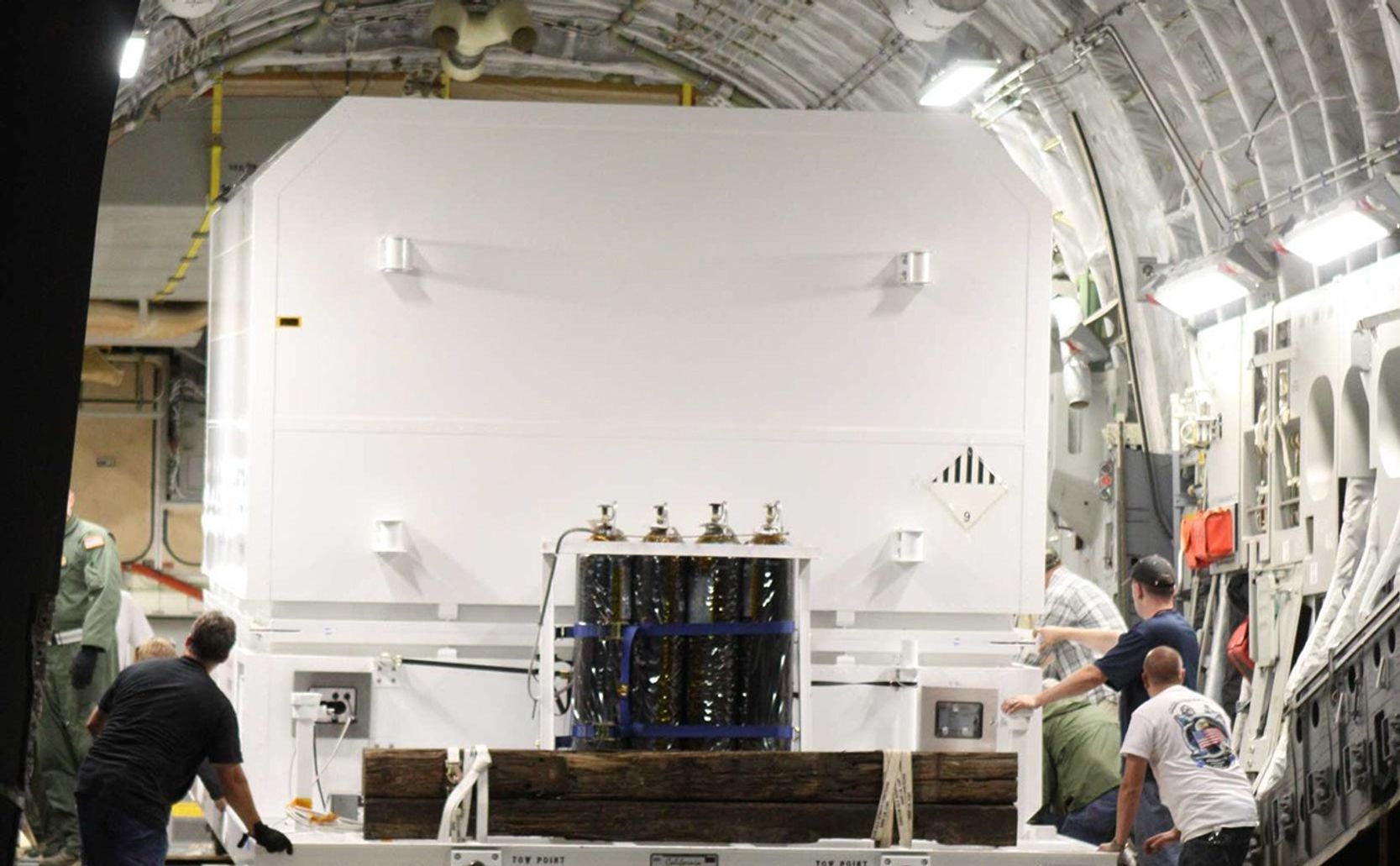 A photo of the Curiosity rover being unloaded from a C-17 transport plane.
