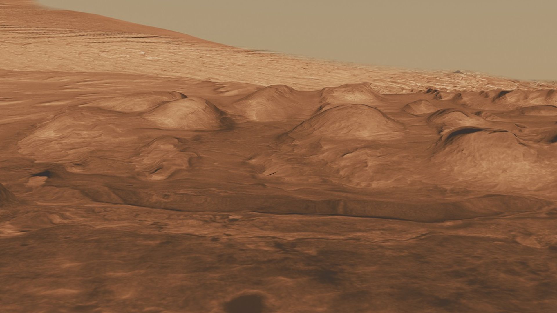 This oblique view of the lower mound in Gale crater shows layers of rock that preserve a record of environments on Mars.