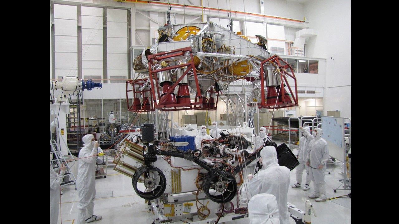 Spacecraft specialists test the descent stage and rover of the Mars Science Laboratory in this scene from the Spacecraft Assembly Facility at NASA's Jet Propulsion Laboratory, Pasadena, Calif.