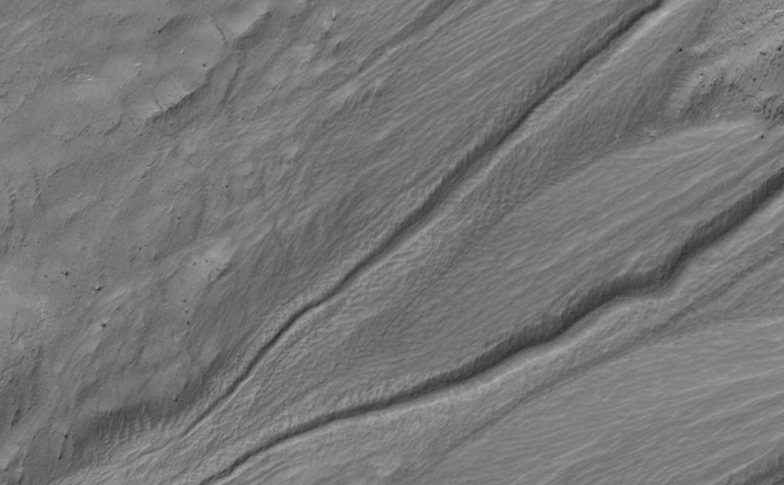 This back and forth comparison shows changes that occurred in a gully on a south-facing slope in middle southern latitudes of Mars.