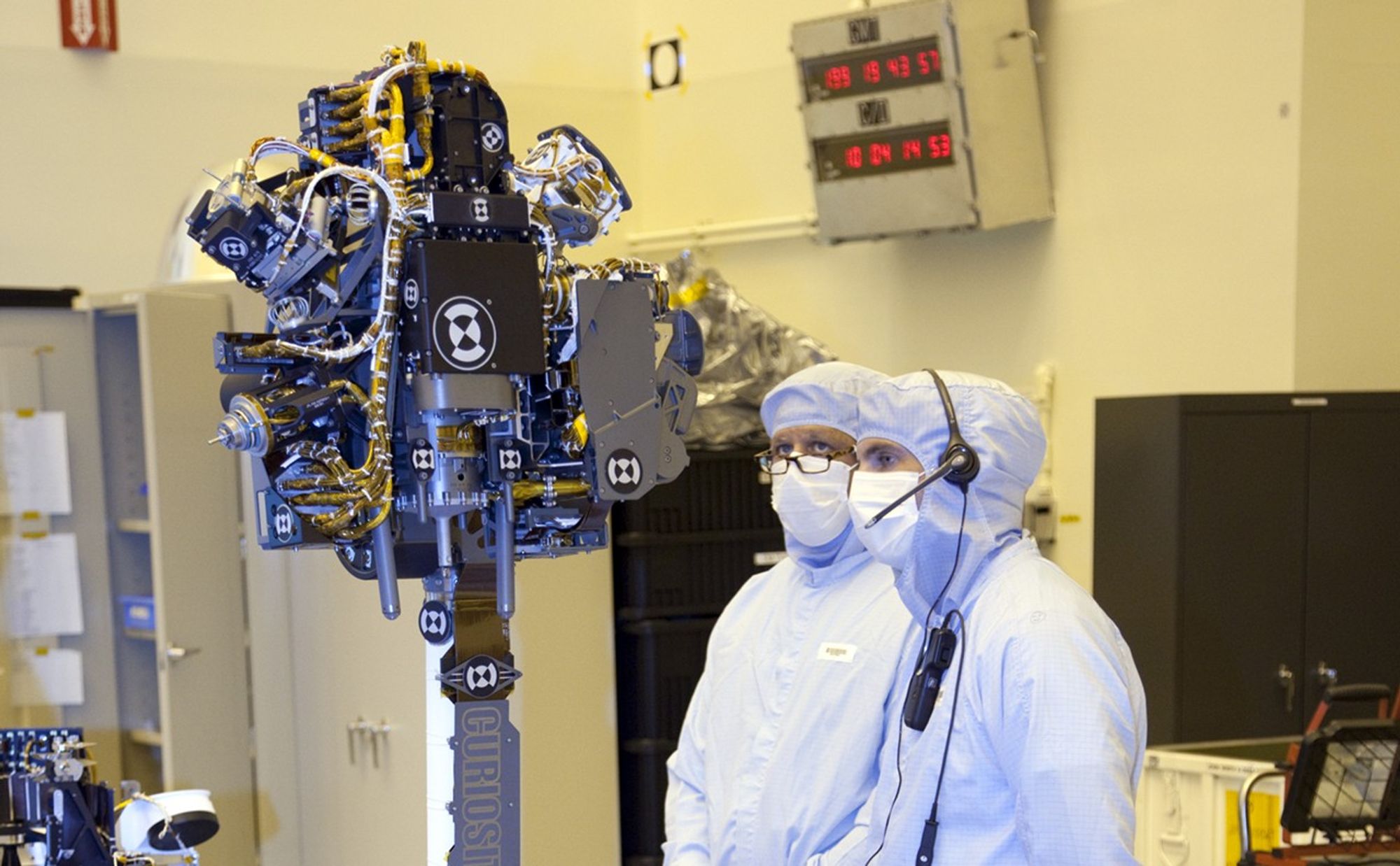 Technicians at the Payload Hazardous Servicing Facility at NASA's Kennedy Space Center in Florida, put the instrument mast and science boom on NASA's Mars Science Laboratory (MSL) rover, known as Curiosity, through a series of deployment tests.