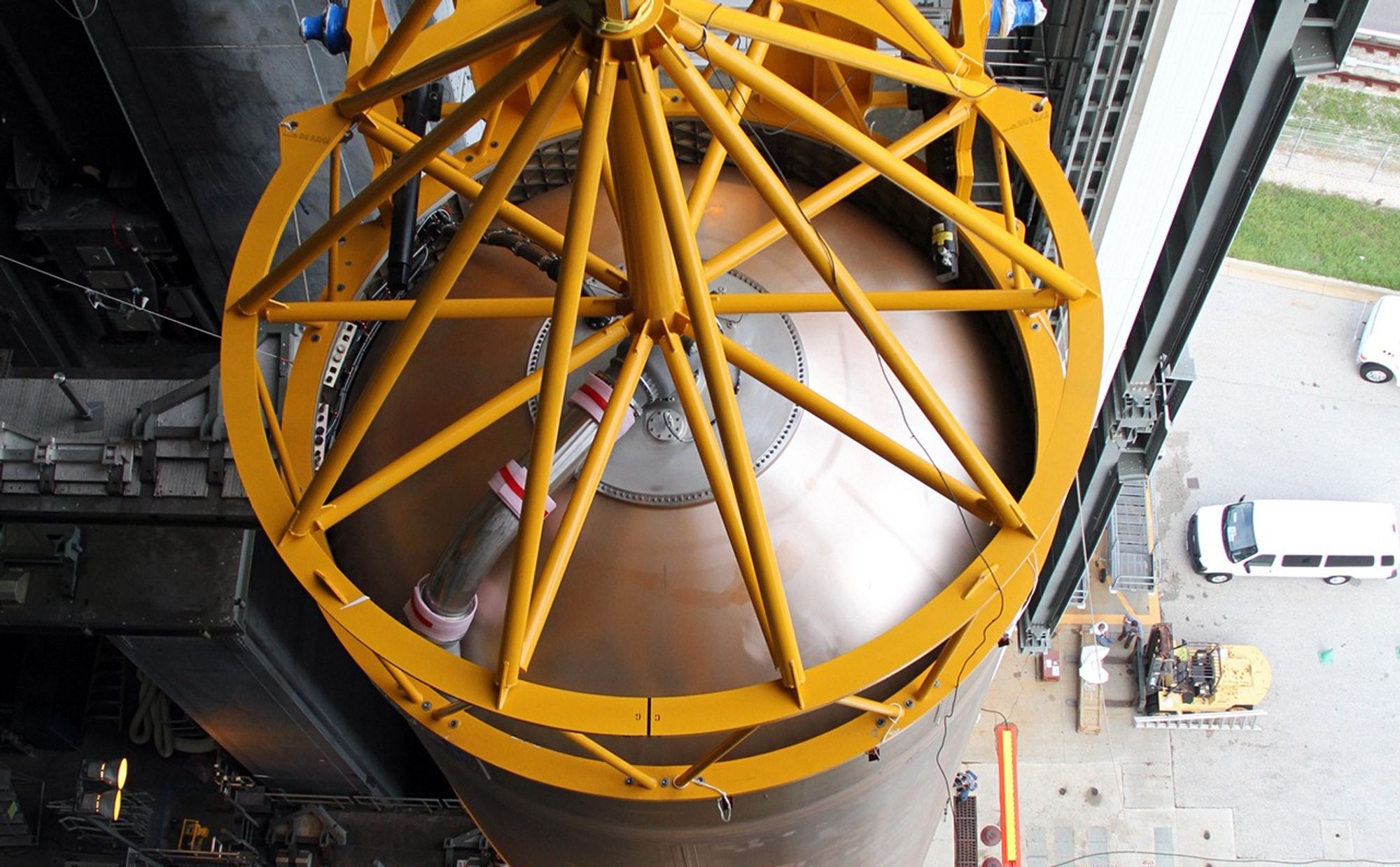 A crane positions the 106.5-foot-long first stage of the Atlas V rocket for NASA's Mars Science Laboratory (MSL) mission inside the Vertical Integration Facility at Space Launch Complex 41 on Cape Canaveral Air Force Station.