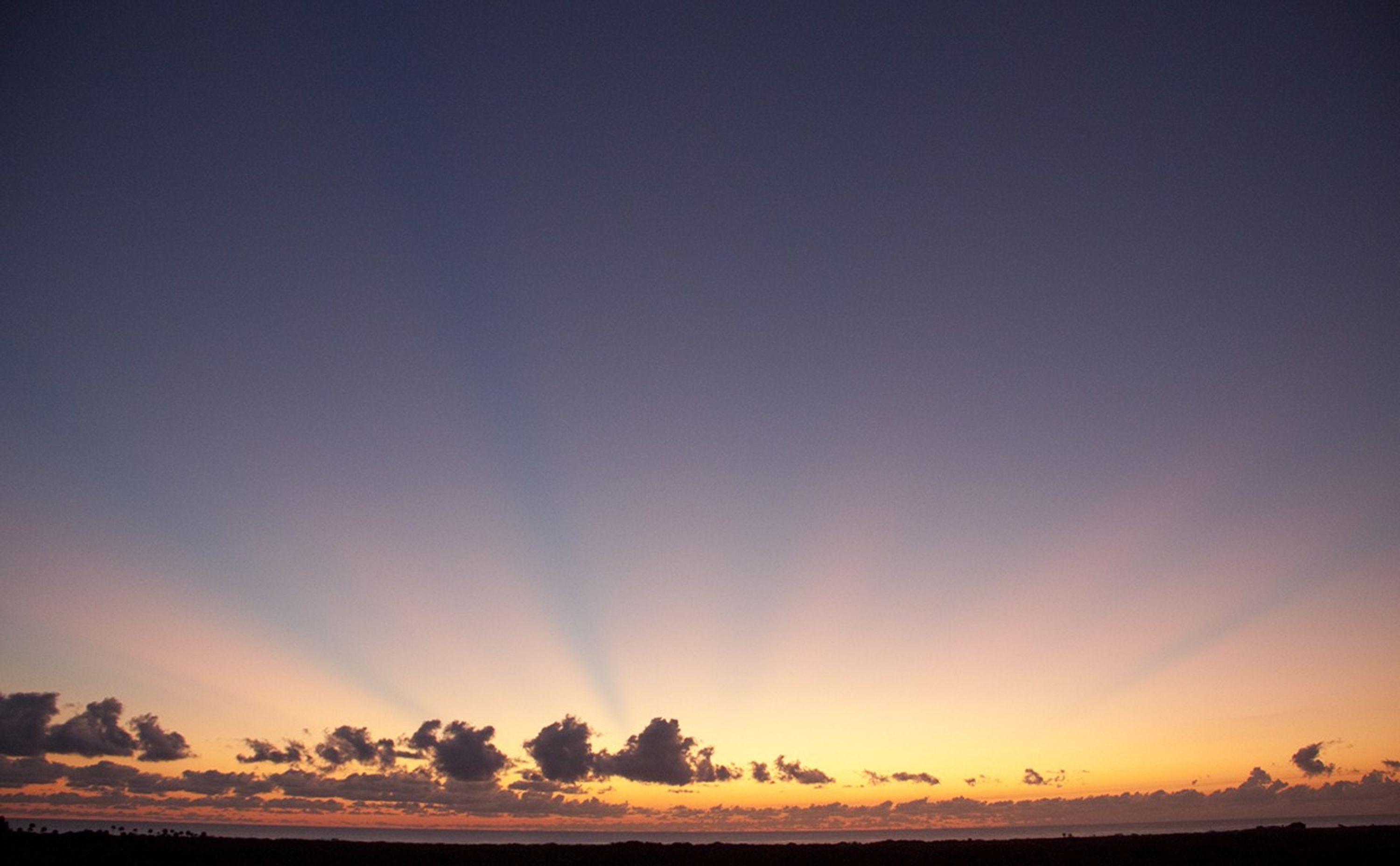 A beautiful sun rises on Florida's space coast as preparations are underway for mating the final solid rocket motor (SRM) to a United Launch Alliance Atlas V rocket at the Vertical Integration Facility at Space Launch Complex 41 on Cape Canaveral Air Force Station.
