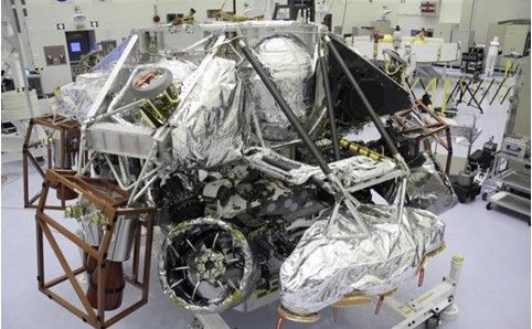 The Mars Science Laboratory mission's "powered descent vehicle" is the integrated combination of the spacecraft's descent stage and the rover Curiosity. It is shown inside the Payload Hazardous Servicing Facility at NASA Kennedy Space Center, Fla. in this photograph taken during final assembly of the spacecraft.