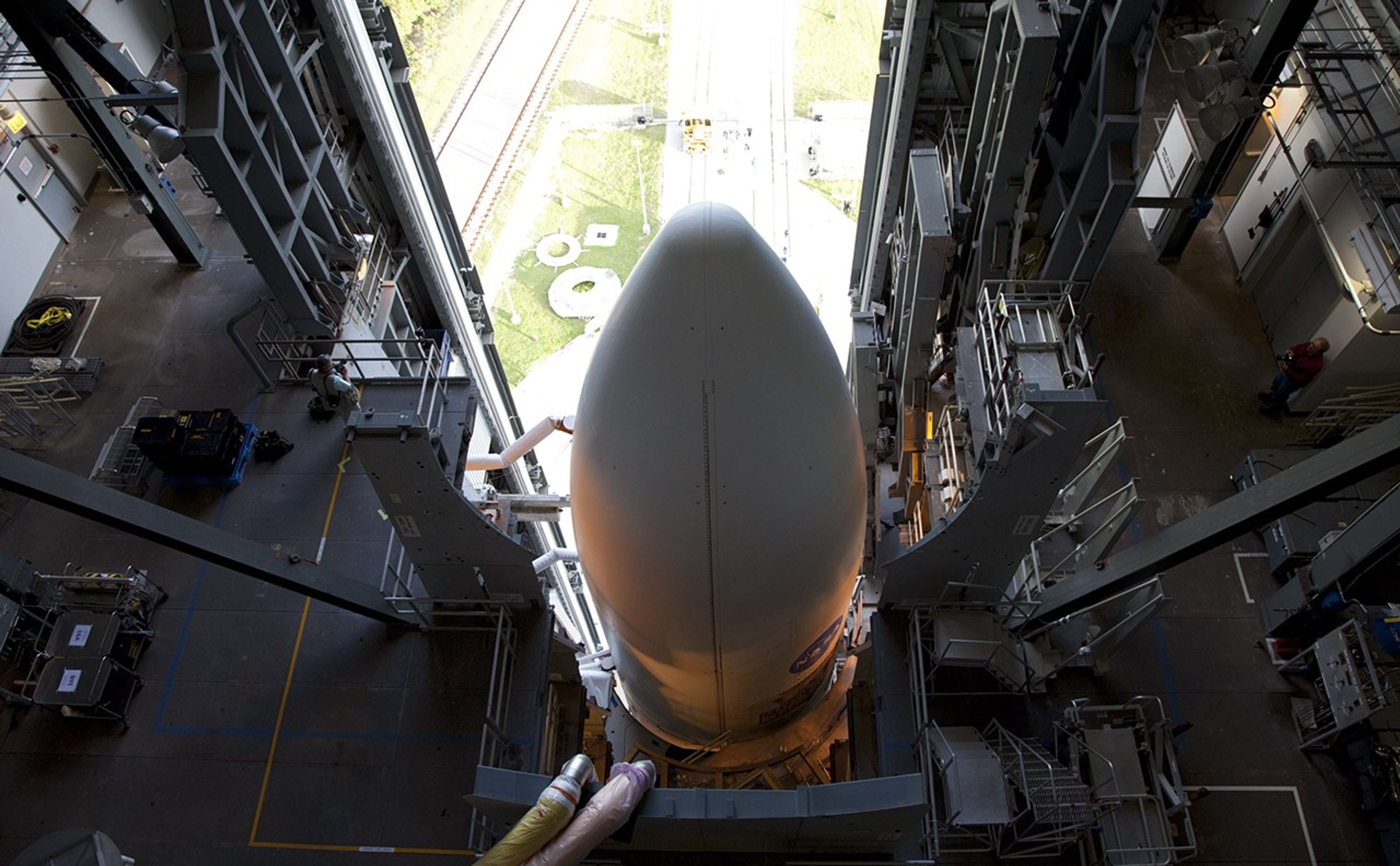 On Cape Canaveral Air Force Station in Florida, the payload fairing protecting NASA's Mars Science Laboratory (MSL) stands atop the 197-foot-tall United Launch Alliance Atlas V rocket, which is ready to roll from the Vertical Integration Facility (VIF) to the launch pad at Space Launch Complex 41.