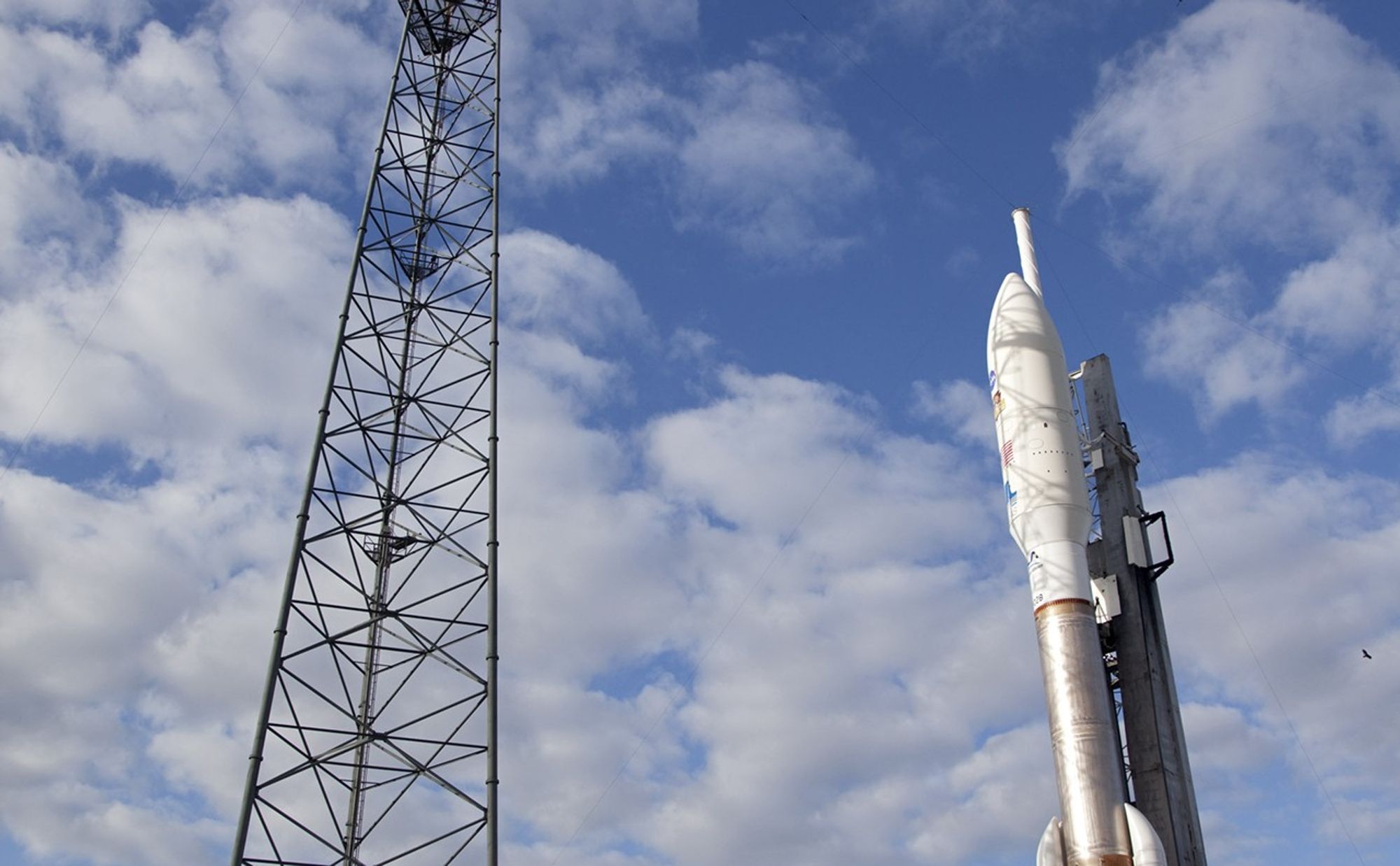 A web of shadows stretches across the 197-foot-tall United Launch Alliance Atlas V rocket as the early morning sun shines through a metal lightning mast (left) at Space Launch Complex 41 on Cape Canaveral Air Force Station in Florida.