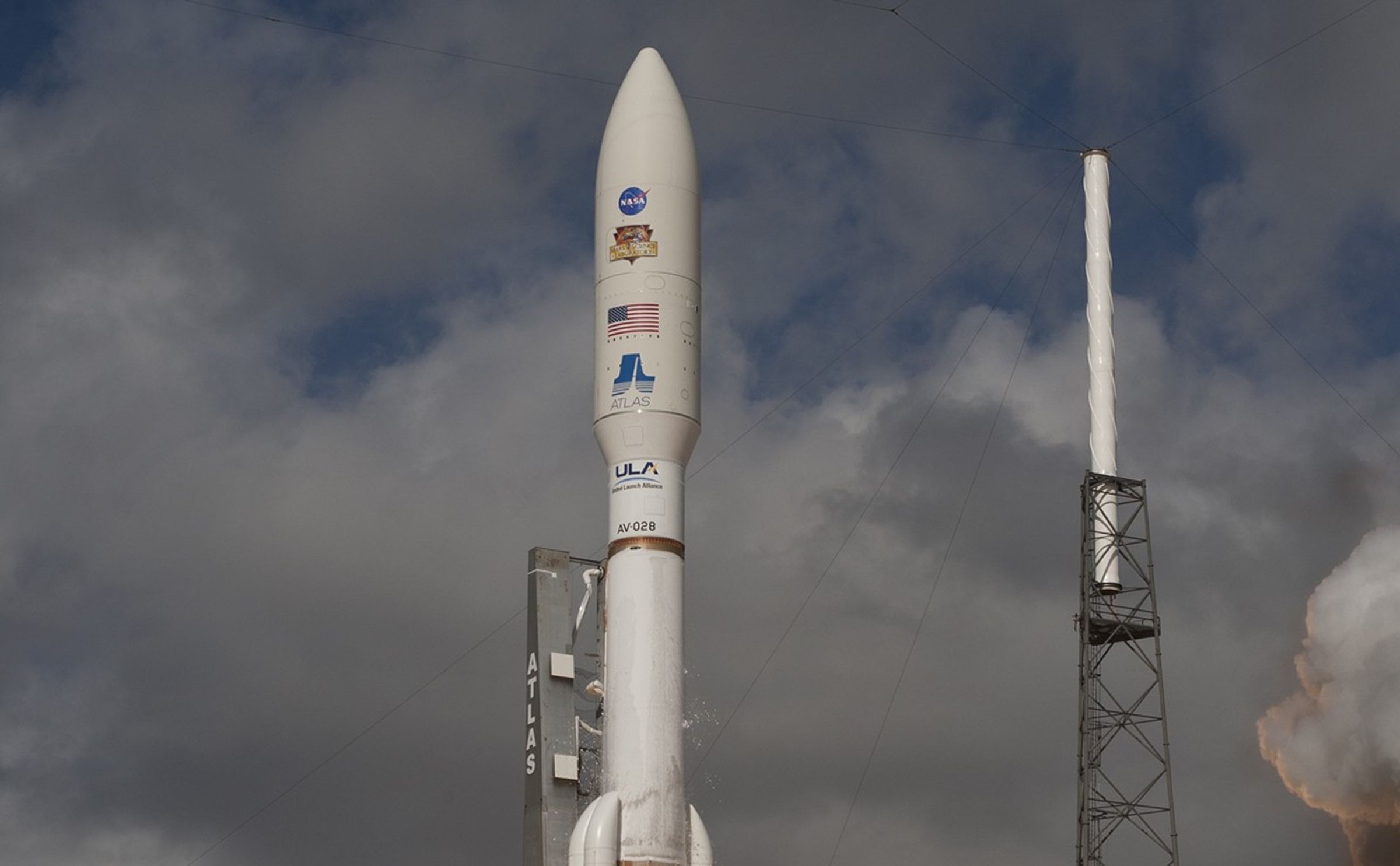 With NASA's Mars Science Laboratory (MSL) spacecraft sealed inside its payload fairing, the United Launch Alliance Atlas V rocket rides smoke and flames as it rises from the launch pad at Space Launch Complex-41 on Cape Canaveral Air Force Station in Florida at 10:02 a.m.