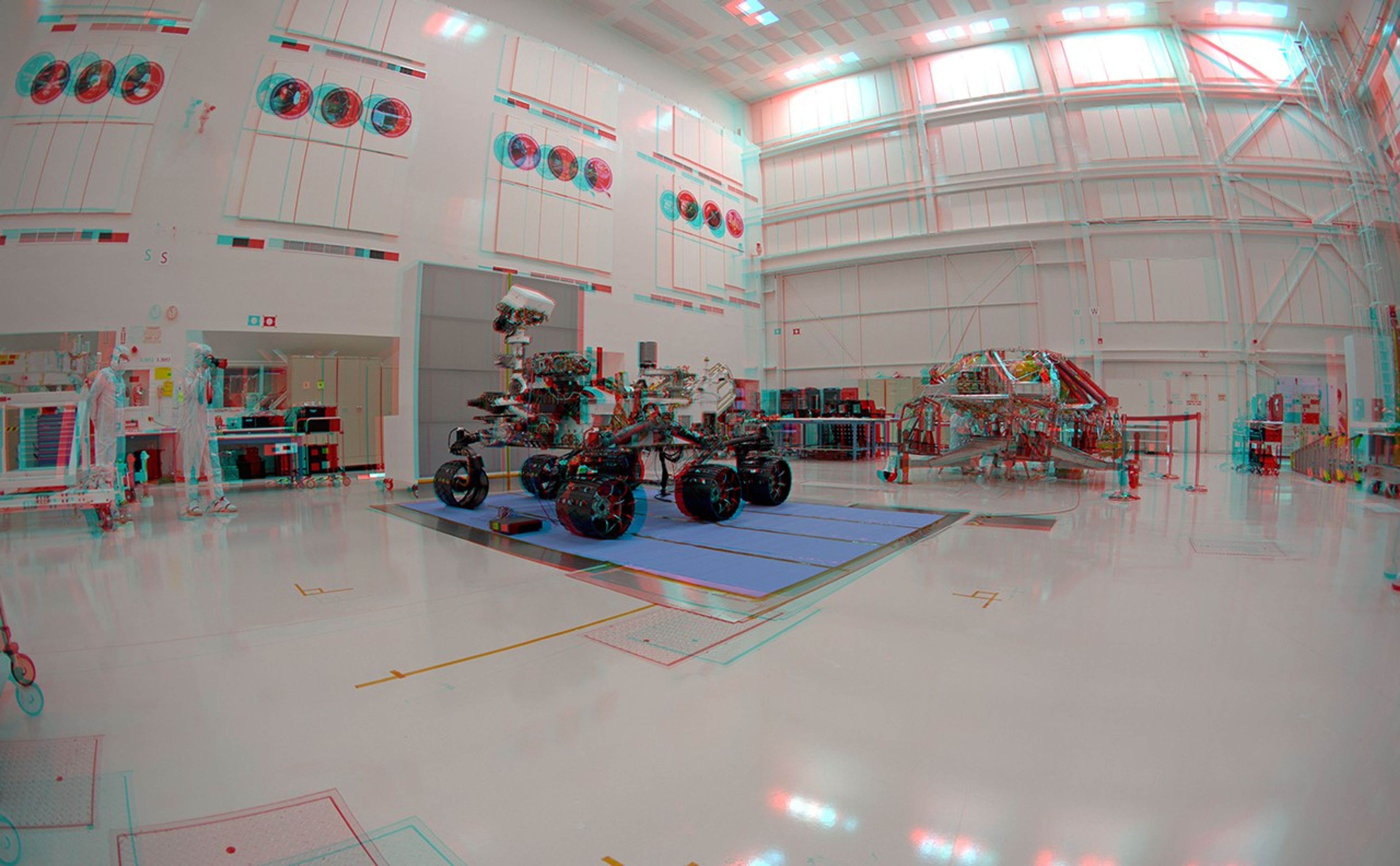 NASA's Curiosity rover and its rocket-powered descent vehicle pose for a portrait at JPL's Spacecraft Assembly Facility.