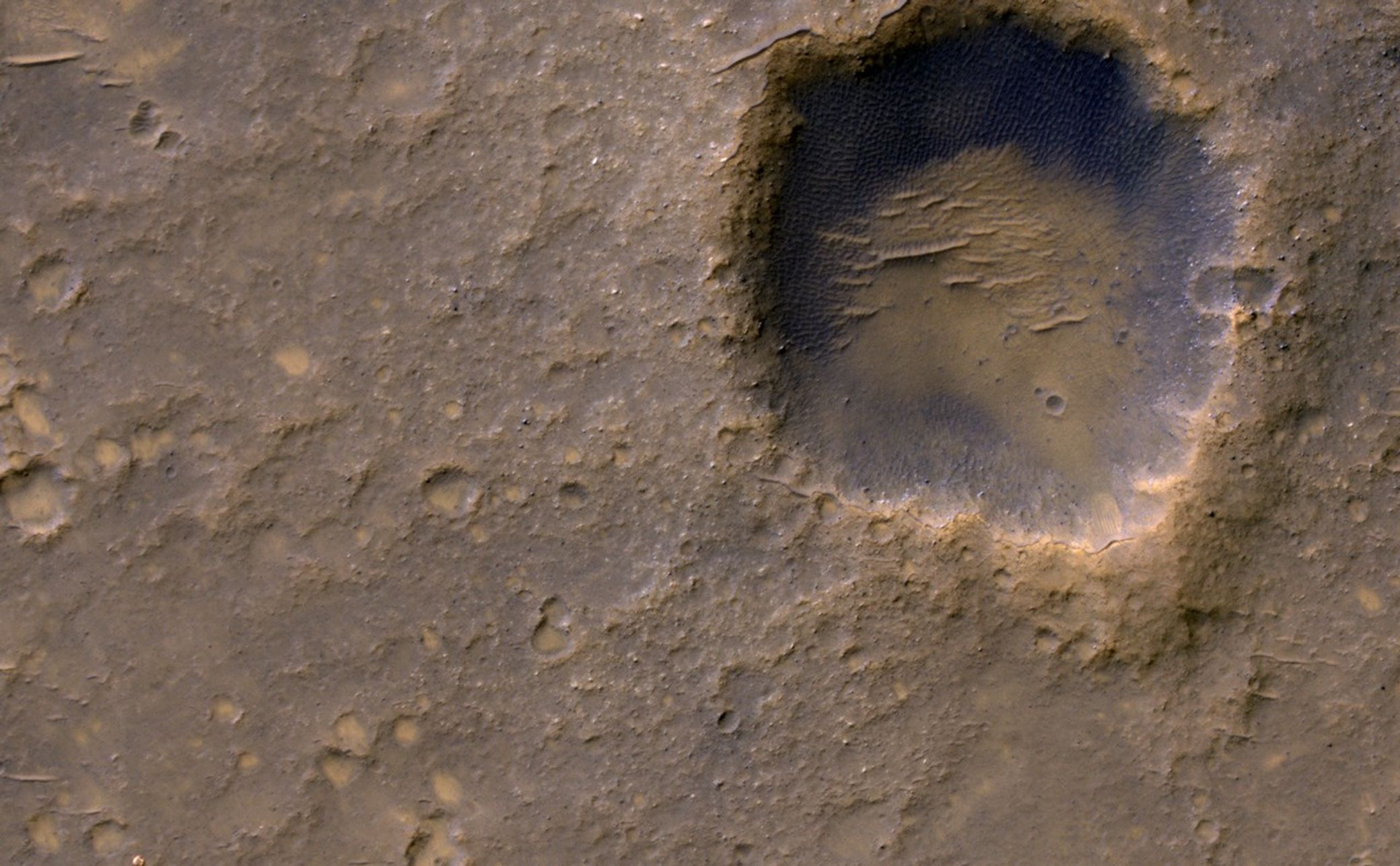 Near the lower left corner of this view is the three-petal lander platform that NASA's Mars Exploration Rover Spirit drove off in January 2004.
