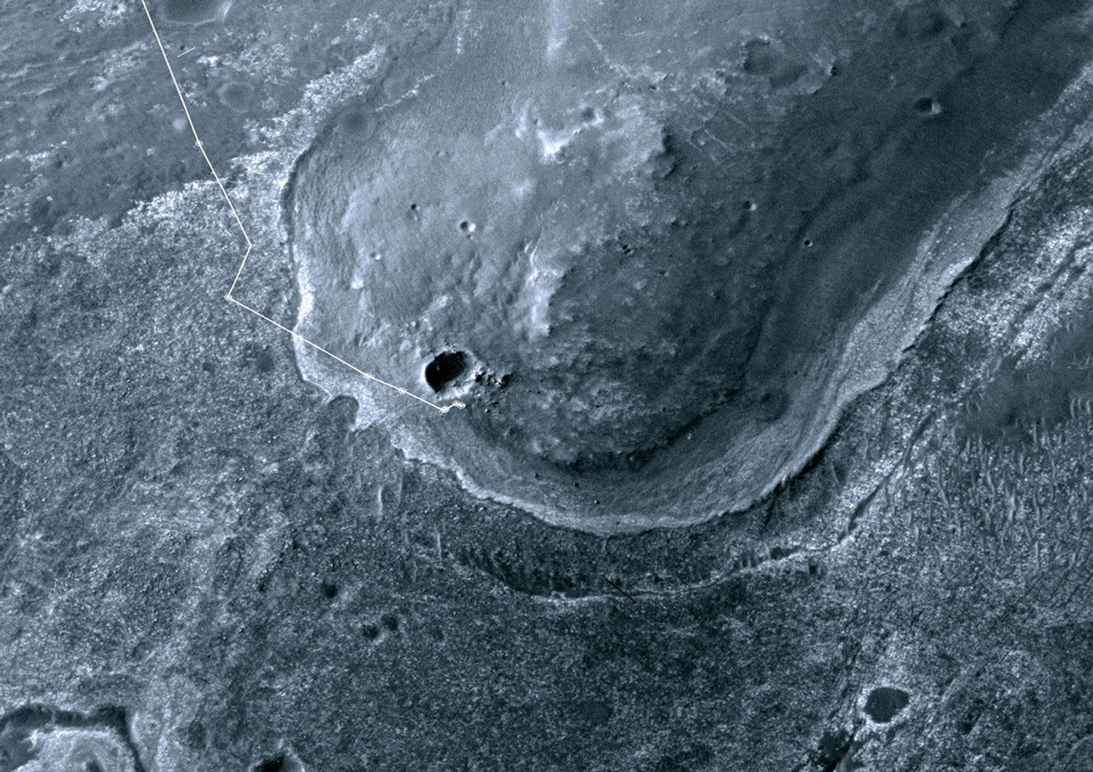 This image taken from orbit shows the path driven by NASA's Mars Exploration Rover Opportunity in the weeks around the rover's arrival at the rim of Endeavour crater.