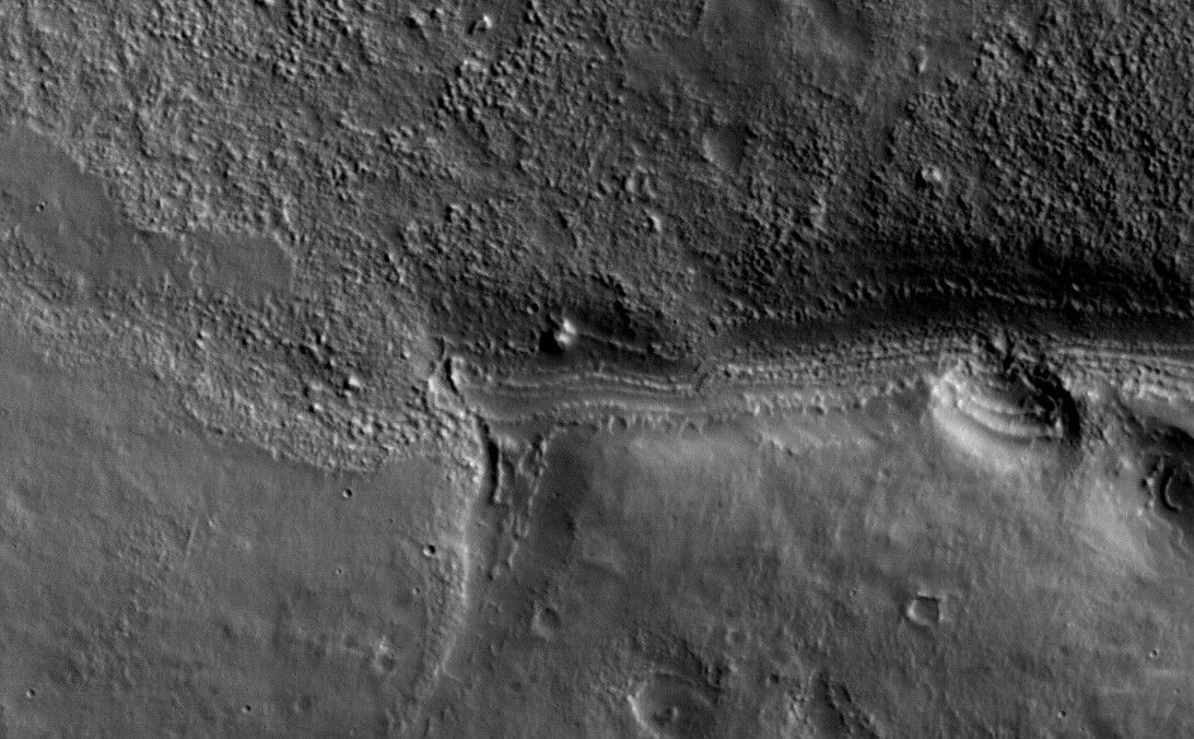 This view shows a full-resolution portion of the first image of Mars taken by the High Resolution Imaging Science Experiment camera (HiRISE) on NASA's Mars Reconnaissance Orbiter.