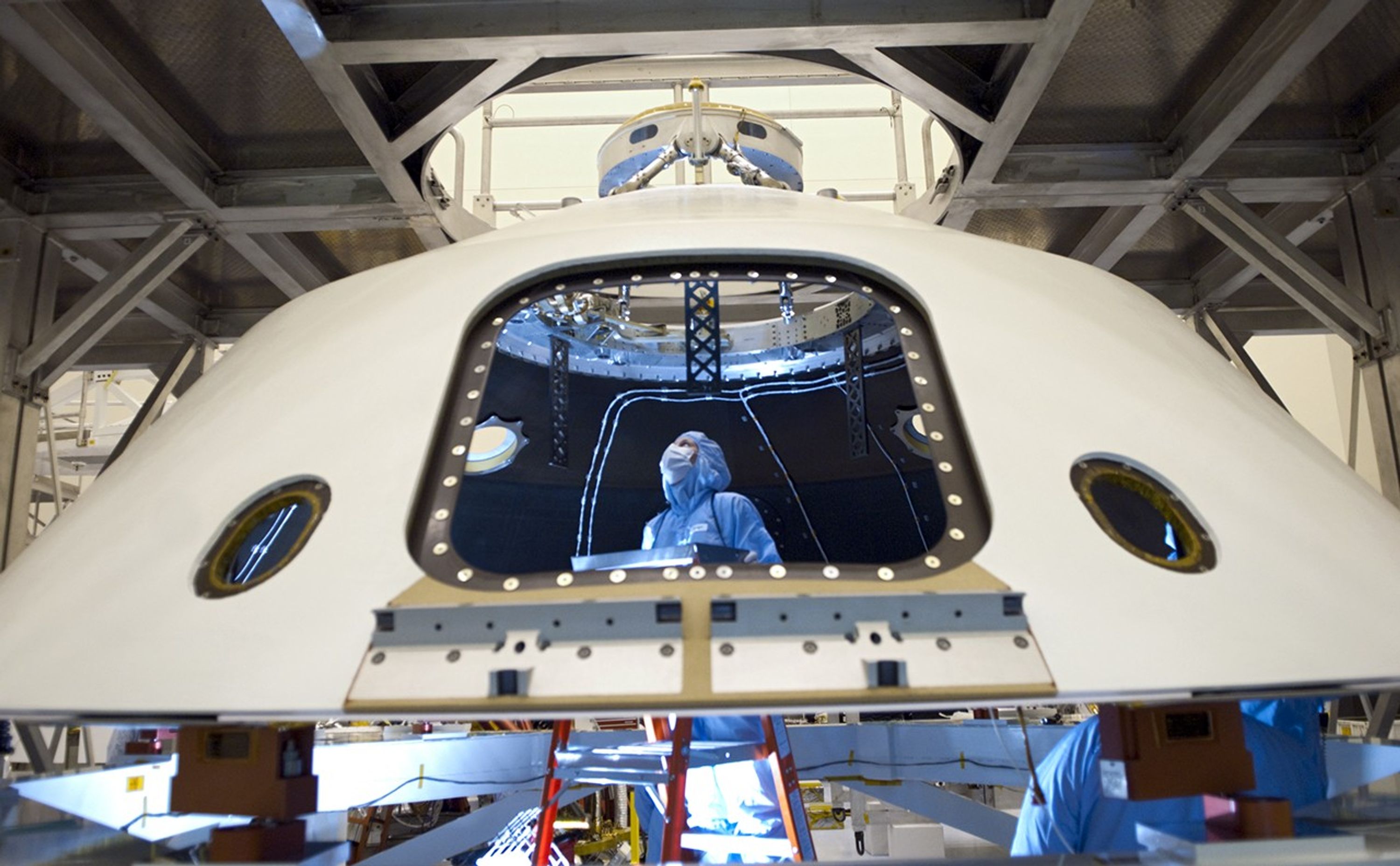 In the Payload Hazardous Servicing Facility at NASA's Kennedy Space Center in Florida, technicians process the backshell for NASA's Mars Science Laboratory (MSL).