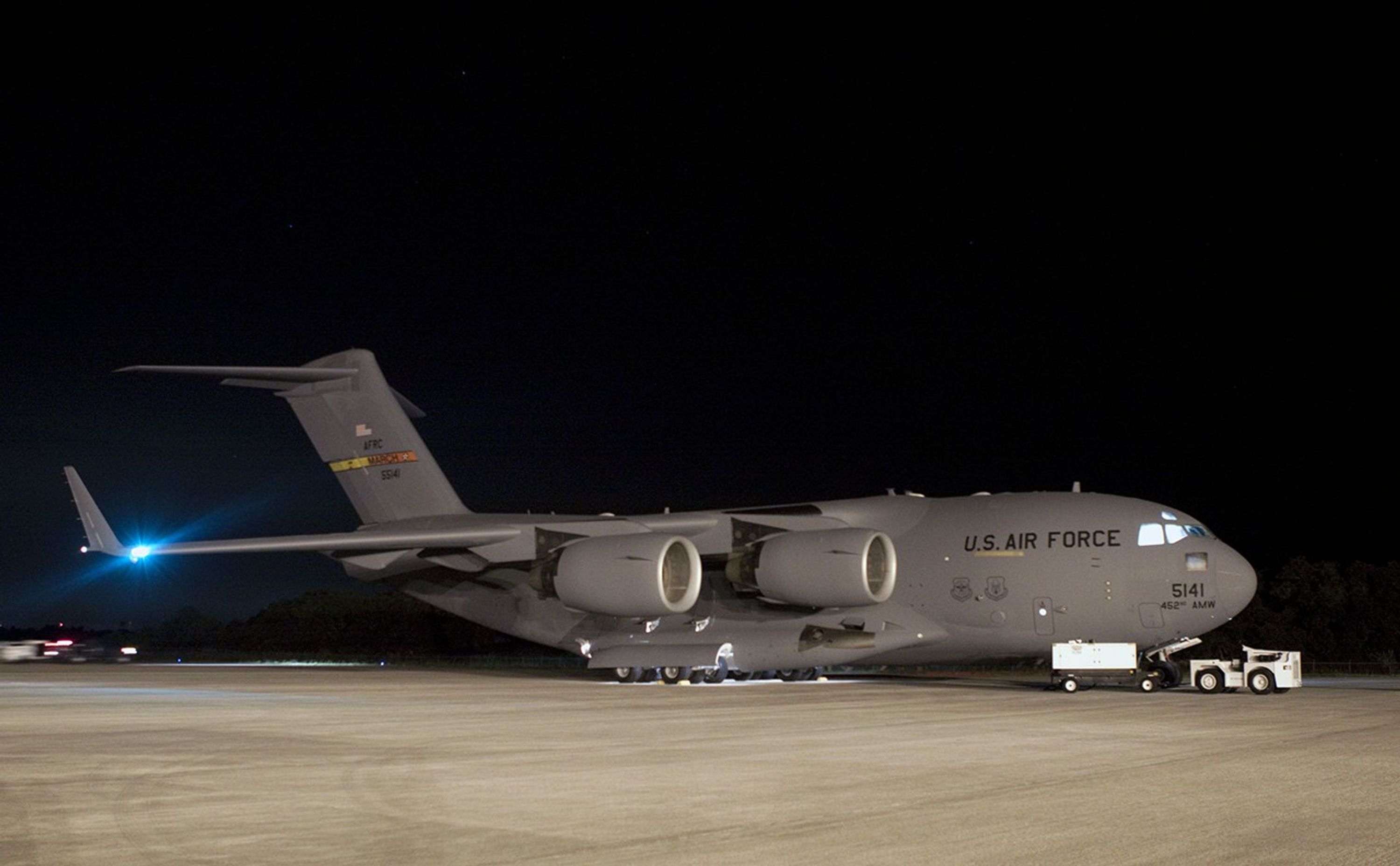 NASA's Mars Science Laboratory (MSL) rover, known as Curiosity, arrives at the Shuttle Landing Facility at NASA's Kennedy Space Center in Florida aboard an Air Force C-17 cargo plane.