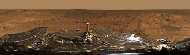 Hundreds of images taken by Spirit were combined into this 360-degree view of "Husband Hill Summit" and the rover's deck.