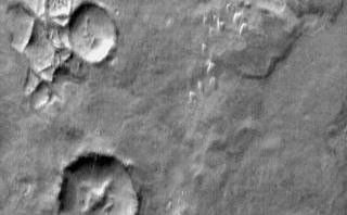 Continuing our survey of non-crater dune fields brings us to this group of dunes in Aonia Terra. The daytime IR illustrates the warmth of the dune material compared to the surrounding materials.