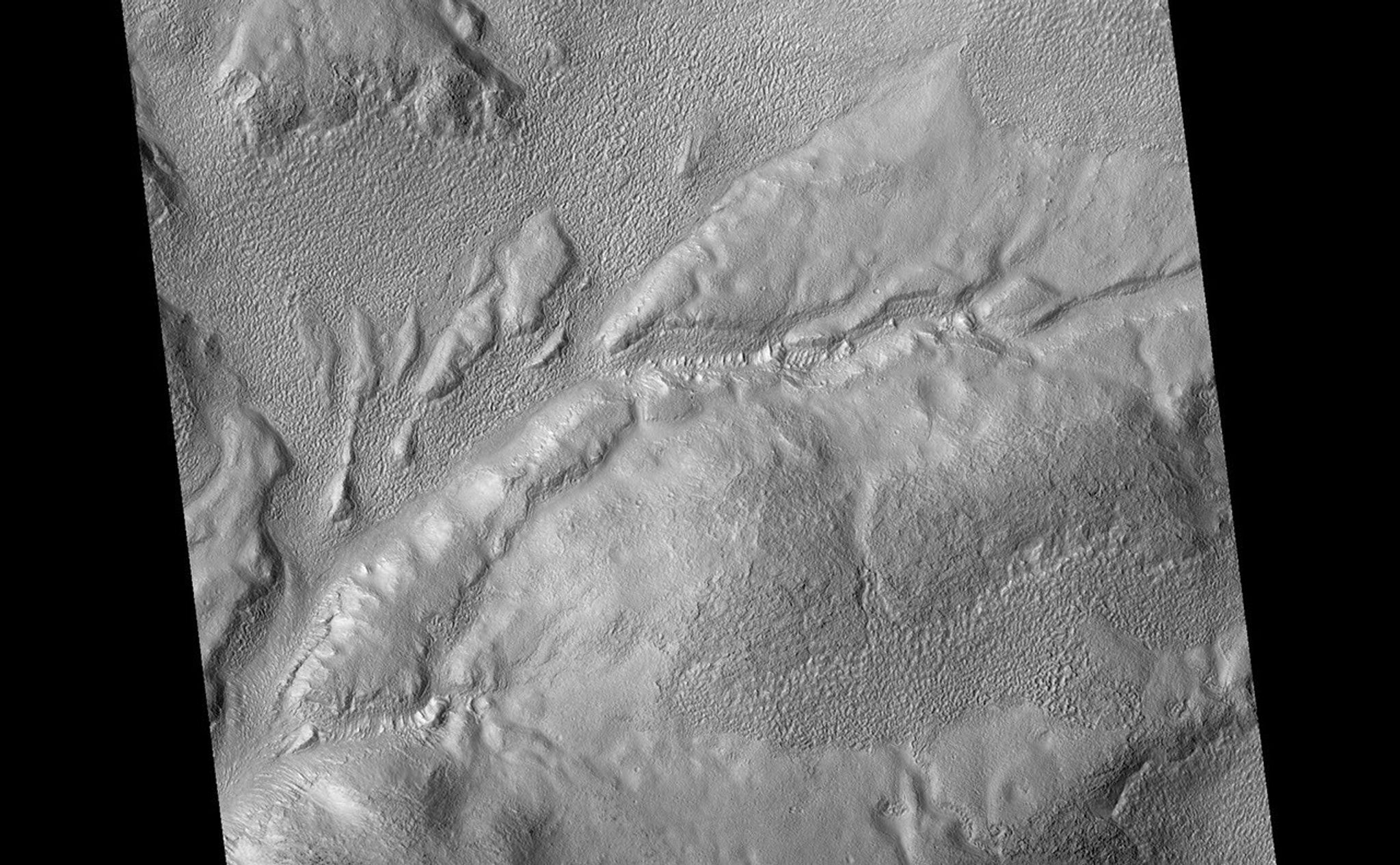 Gullies and Flow Features along Crater Wall in Promethei Terra