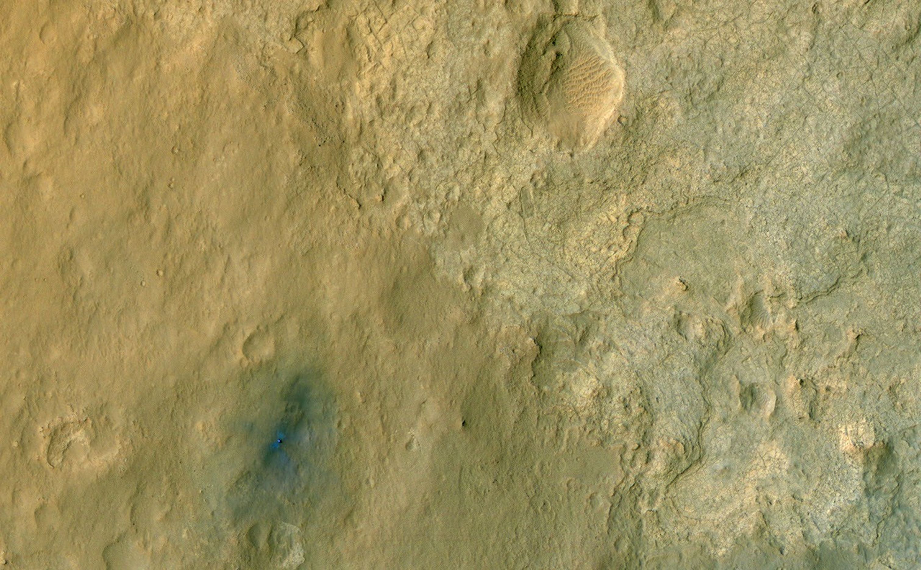 This color-enhanced view of NASA's Curiosity rover on the surface of Mars was taken by the High Resolution Imaging Science Experiment (HiRISE) on NASA's Mars Reconnaissance Orbiter as the satellite flew overhead.