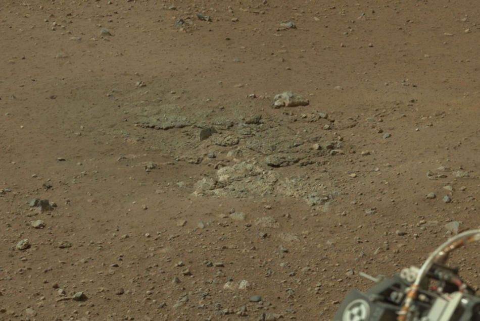 This cropped image from NASA's Curiosity rover shows one set of marks on the surface of Mars where blasts from the descent-stage rocket engines blew away some of the surface material.