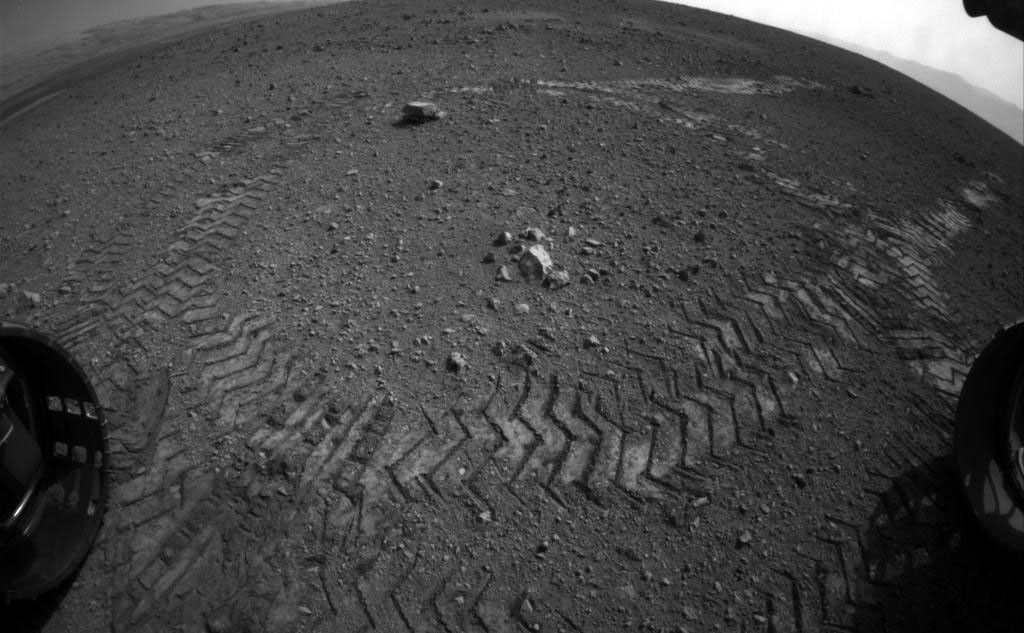 This image shows the tracks left by NASA's Curiosity rover on Aug. 22, 2012, as it completed its first test drive on Mars.