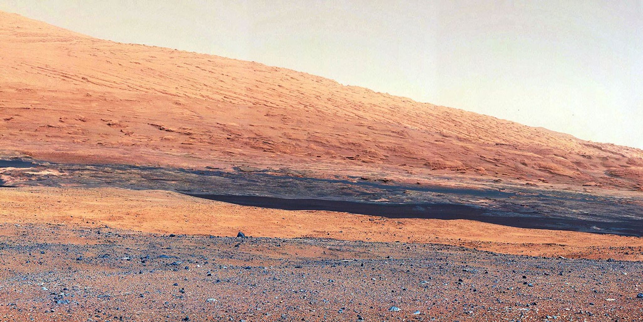 This image taken by the Mast Camera (MastCam) on NASA's Curiosity rover highlights the interesting geology of Mount Sharp, a mountain inside Gale Crater, where the rover landed.