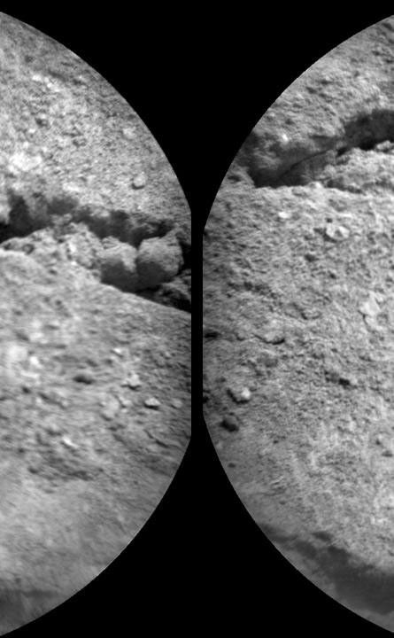 The Chemistry and Camera (ChemCam) instrument on NASA's Mars rover Curiosity used its laser to examine side-by-side points in a target patch of soil, leaving the marks apparent in this before-and-after comparison.