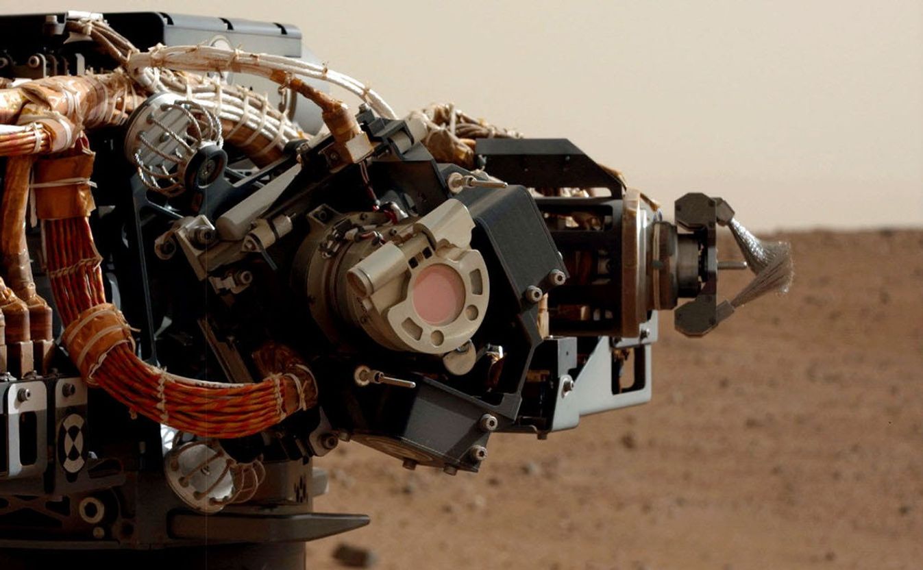 The left eye of the Mast Camera (Mastcam) on NASA's Mars rover Curiosity took this image of the camera on the rover's arm, the Mars Hand Lens Imager (MAHLI), during the 30th Martian day, or sol, of the rover's mission on Mars (Sept. 5, 2012).