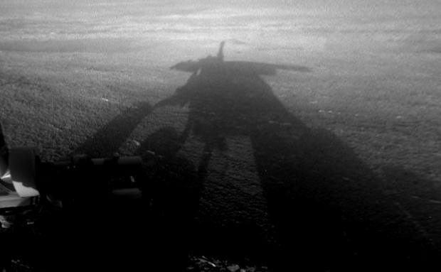 NASA's Mars Exploration Rover Opportunity captured this view of its afternoon shadow stretching into Endeavour Crater during the 3,051st Martian day, or sol, of Opportunity's work on Mars (Aug. 23, 2012).
