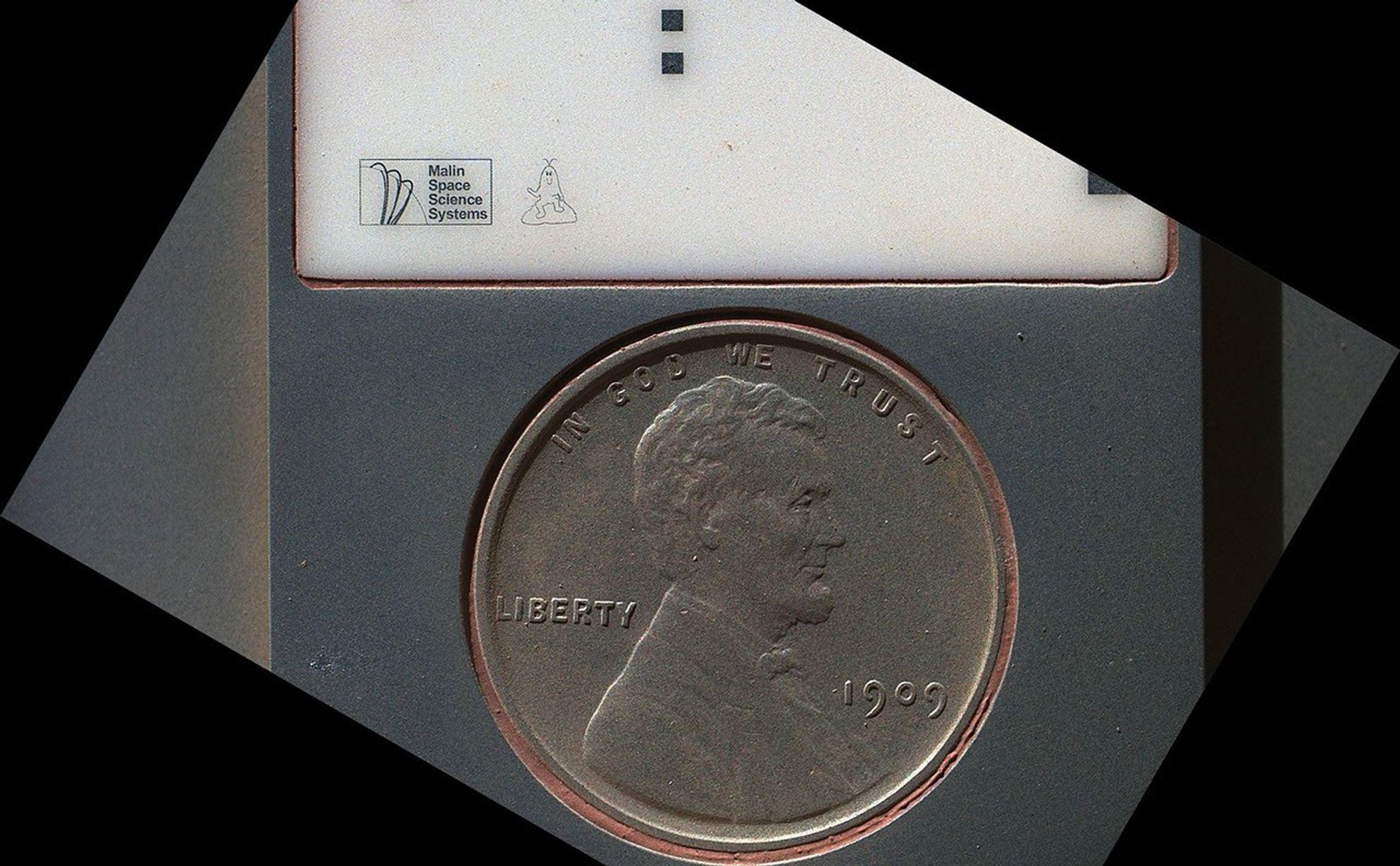 The penny in this image is part of a camera calibration target on NASA's Mars rover Curiosity.