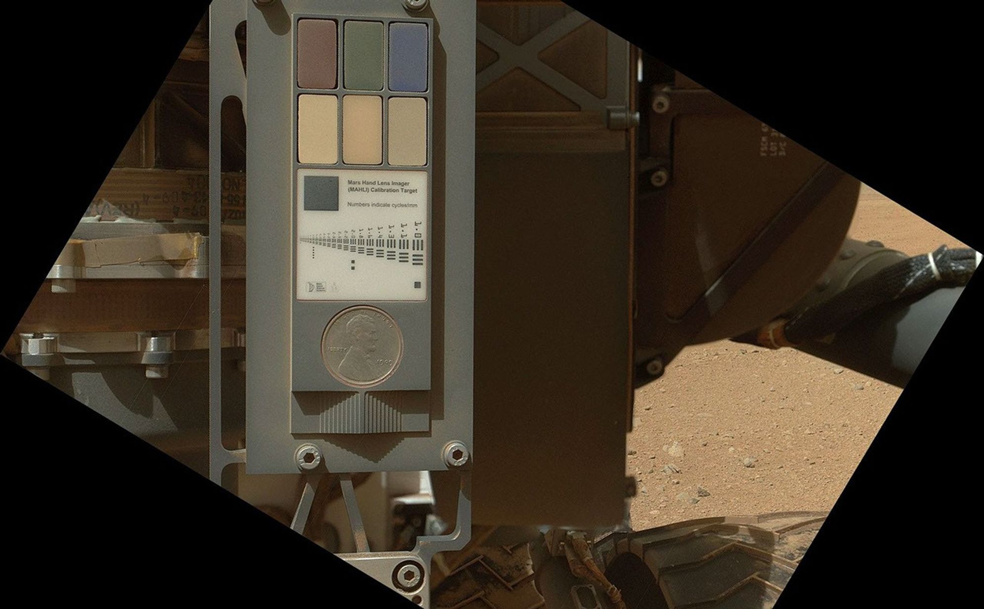 This view of the calibration target for the Mars Hand Lens Imager (MAHLI) aboard NASA's Mars rover Curiosity combines two images taken by that camera during the 34th Martian day, or sol, of Curiosity's work on Mars (Sept. 9, 2012).