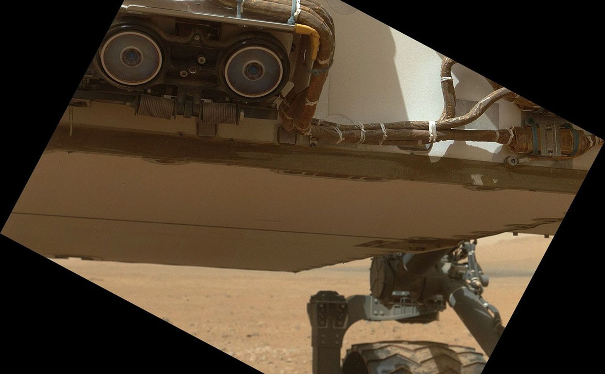 This view of the lower front and underbelly areas of NASA's Mars rover Curiosity was taken by the rover's Mars Hand Lens Imager (MAHLI) during the 34th Martian day, or sol, of Curiosity's work on Mars (Sept. 9, 2012).