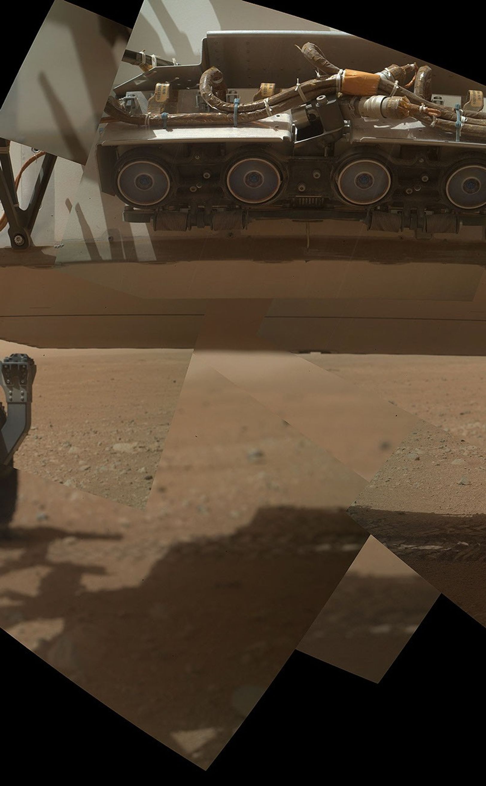 This view of the lower front and underbelly areas of NASA's Mars rover Curiosity combines nine images taken by the rover's  Mars Hand Lens Imager (MAHLI) during the 34th Martian day, or sol, of Curiosity's work on Mars (Sept. 9, 2012).