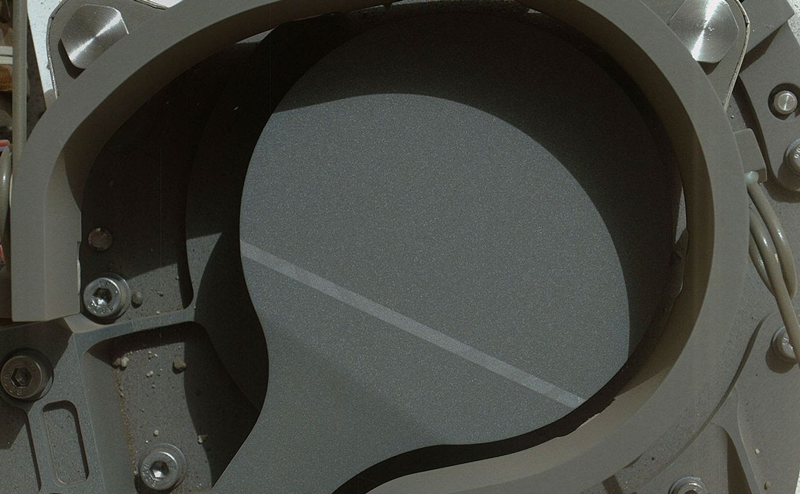 This image from NASA's Curiosity rover shows the cover on an inlet that will receive powdered rock and soil samples for analysis.